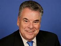 Peter king posing for a picture with a smile